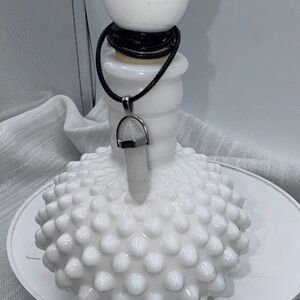 Quartz pendant 1.75” on a 9” cord held together by a Silvertone pendant holder